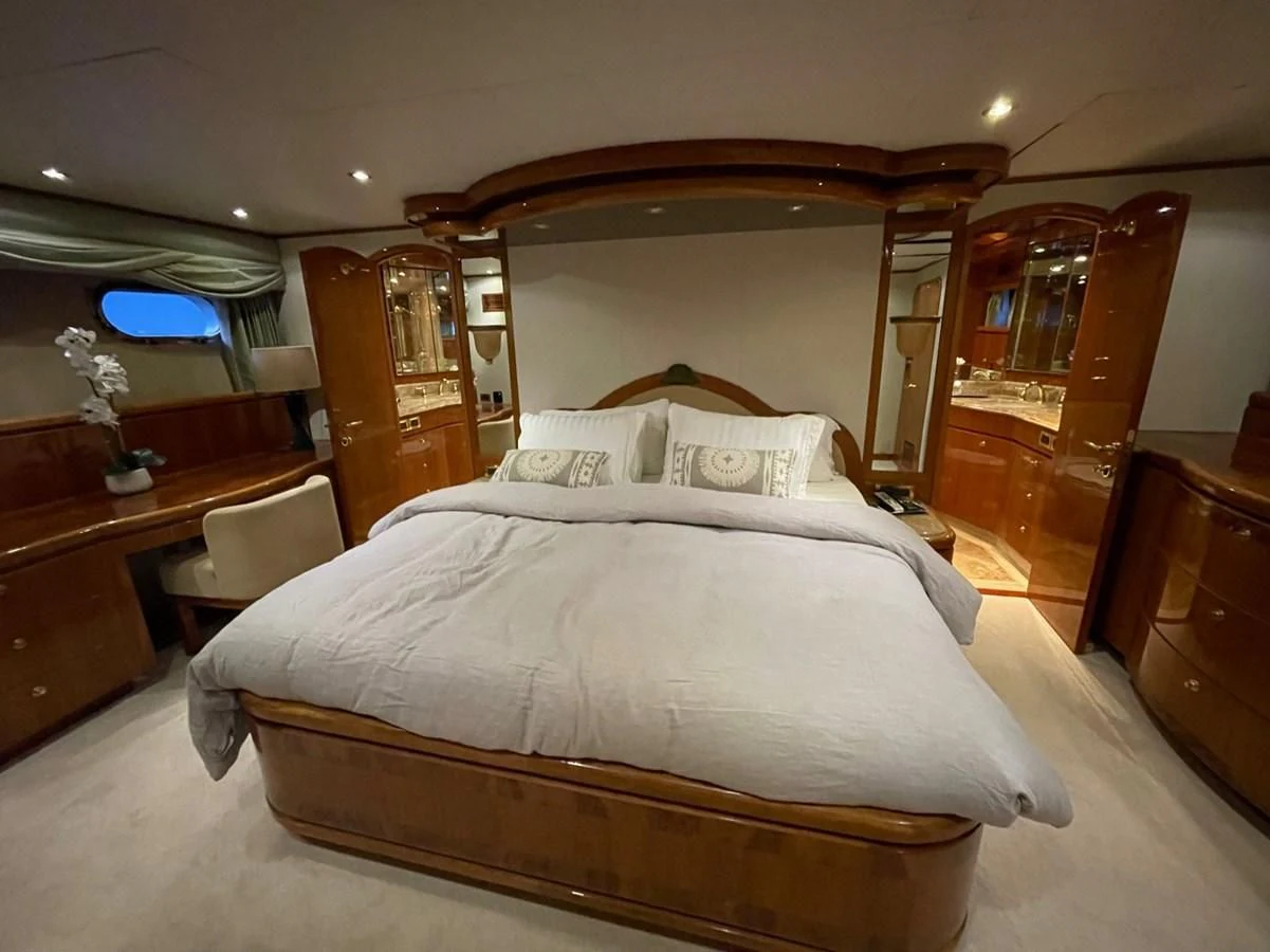 a bed in a hotel room aboard HAPPY Yacht for Sale