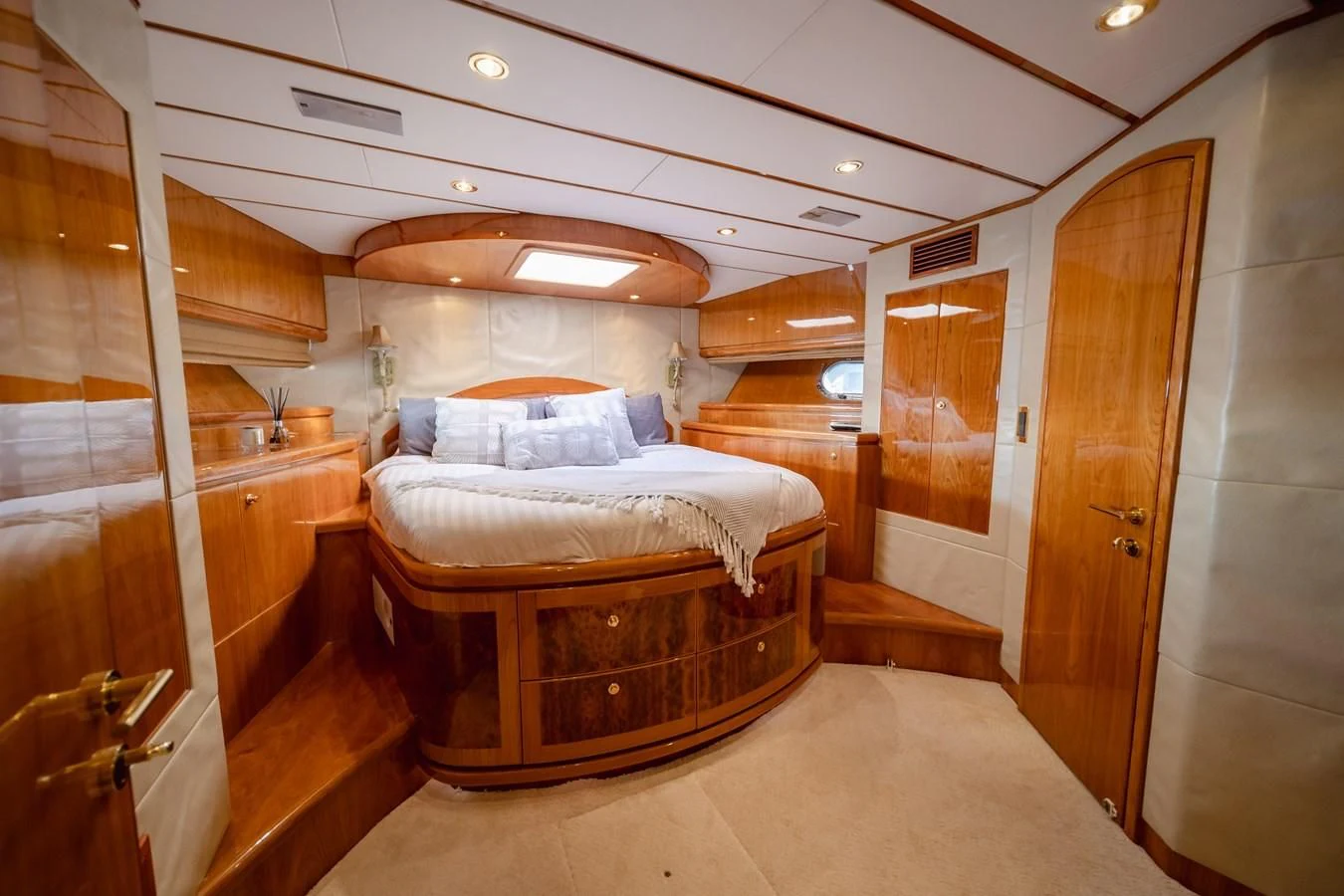 a room with a bed and a closet aboard HAPPY Yacht for Sale