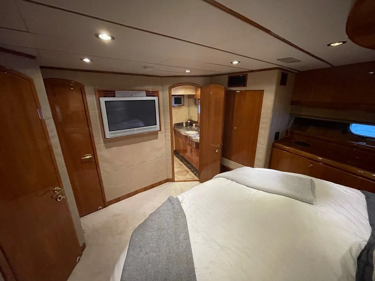 a hotel room with a bed aboard HAPPY Yacht for Sale
