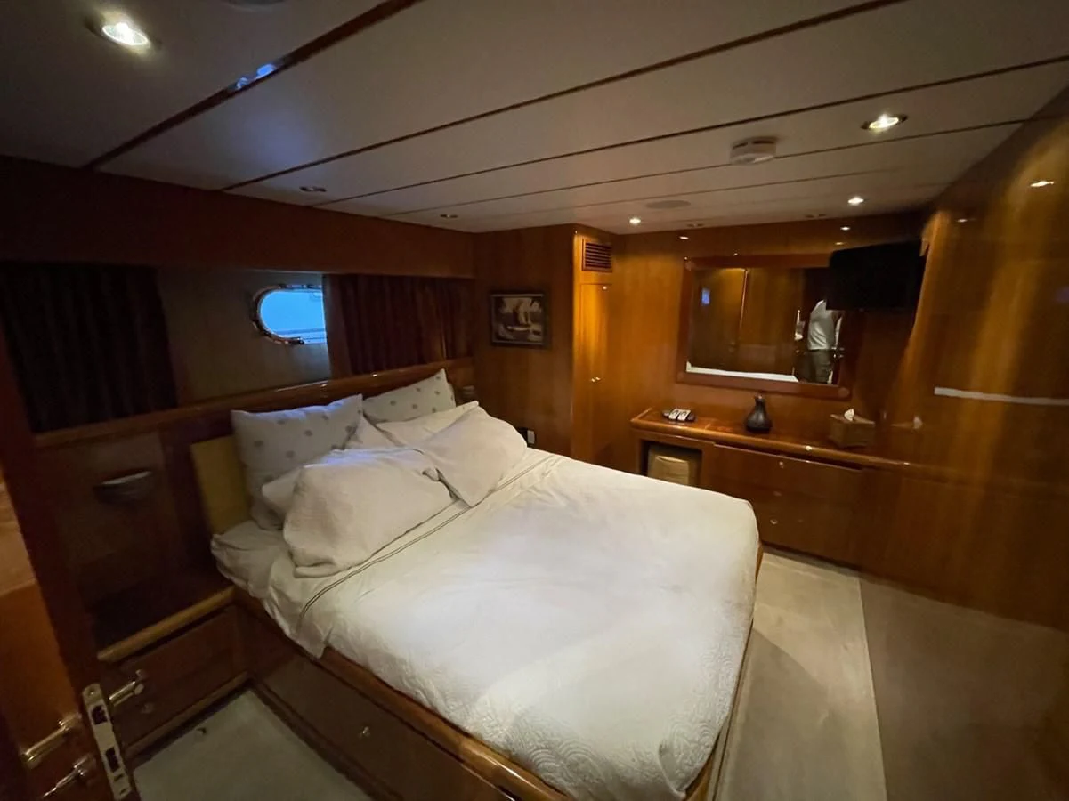 a bed in a room aboard HAPPY Yacht for Sale