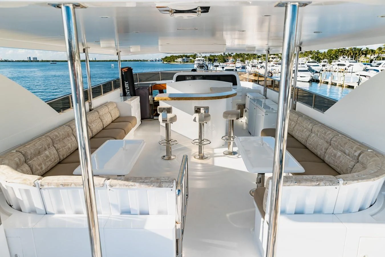 a room with a table and chairs aboard HAPPY Yacht for Sale