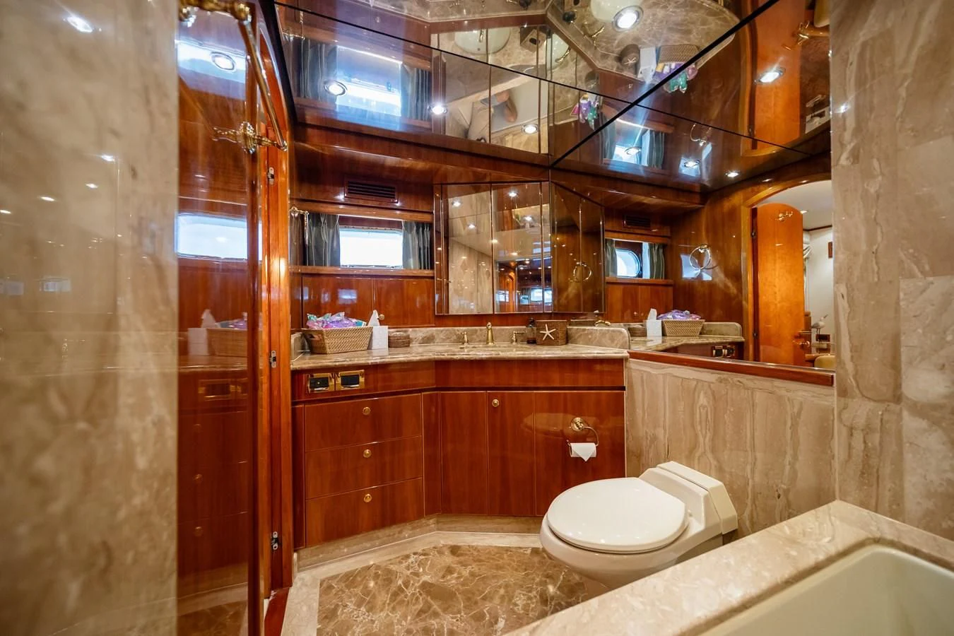 a bathroom with a glass shower aboard HAPPY Yacht for Sale