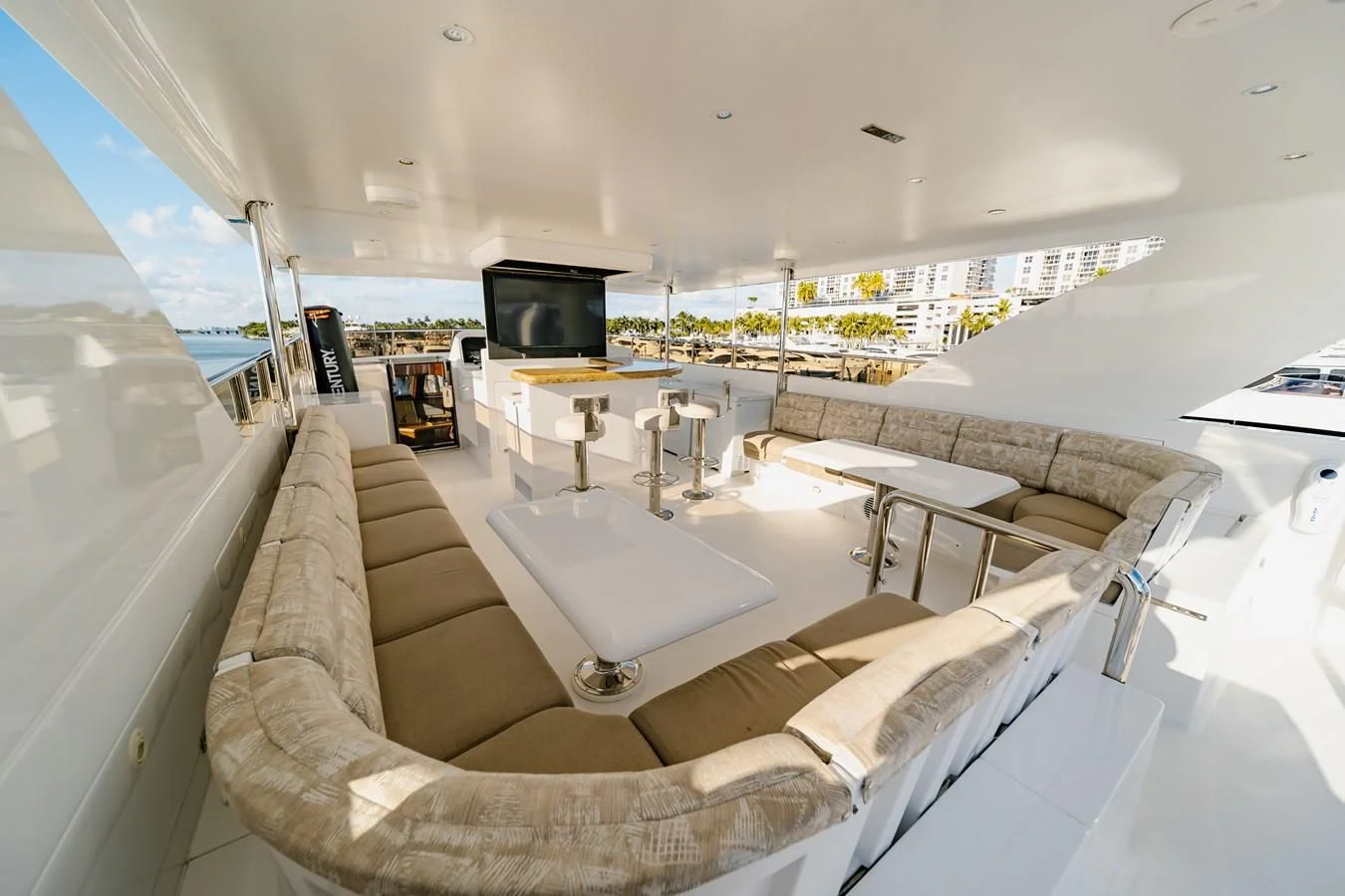 a room with a couch and a television aboard HAPPY Yacht for Sale
