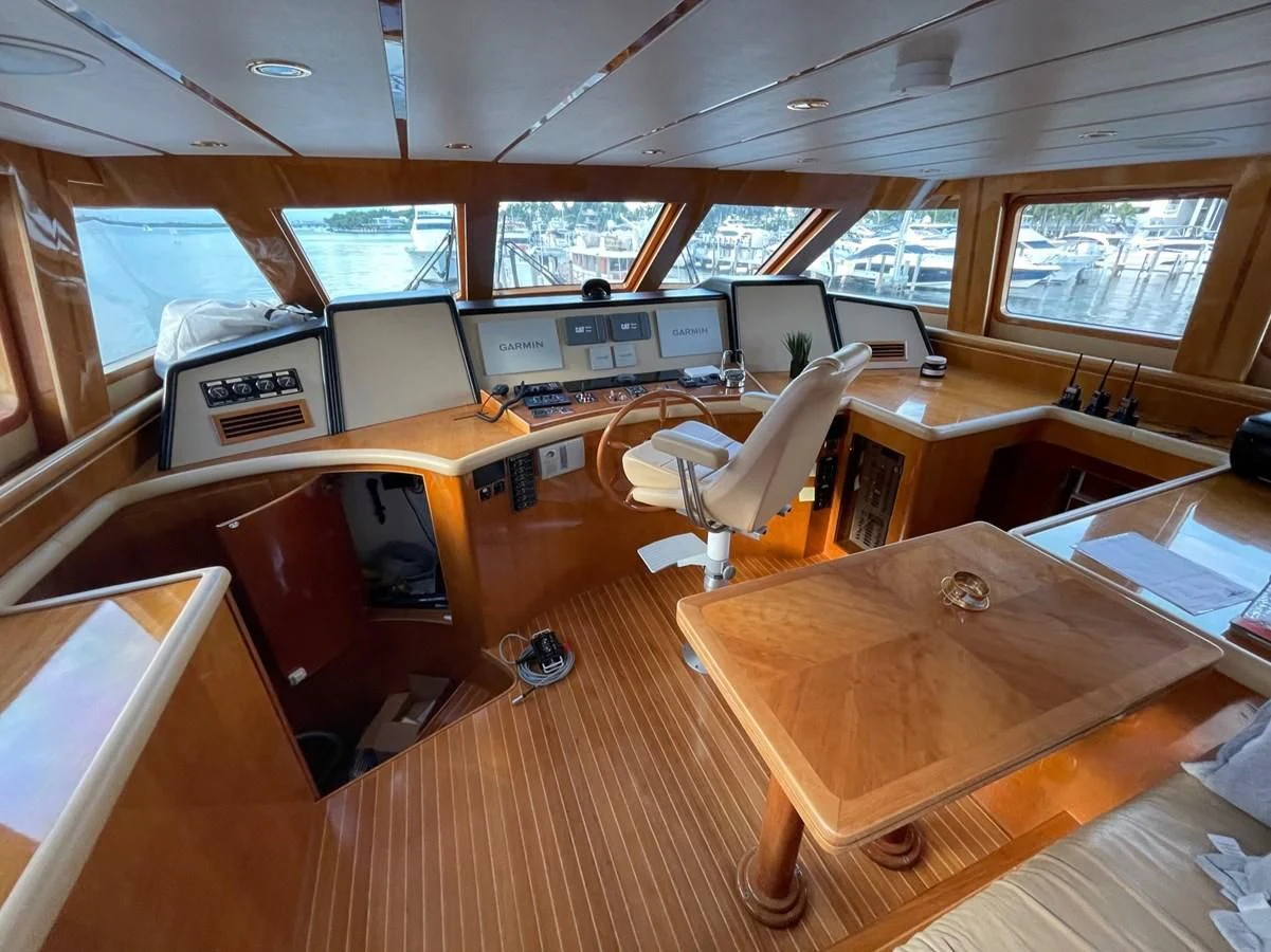 a room with computers and chairs aboard HAPPY Yacht for Sale