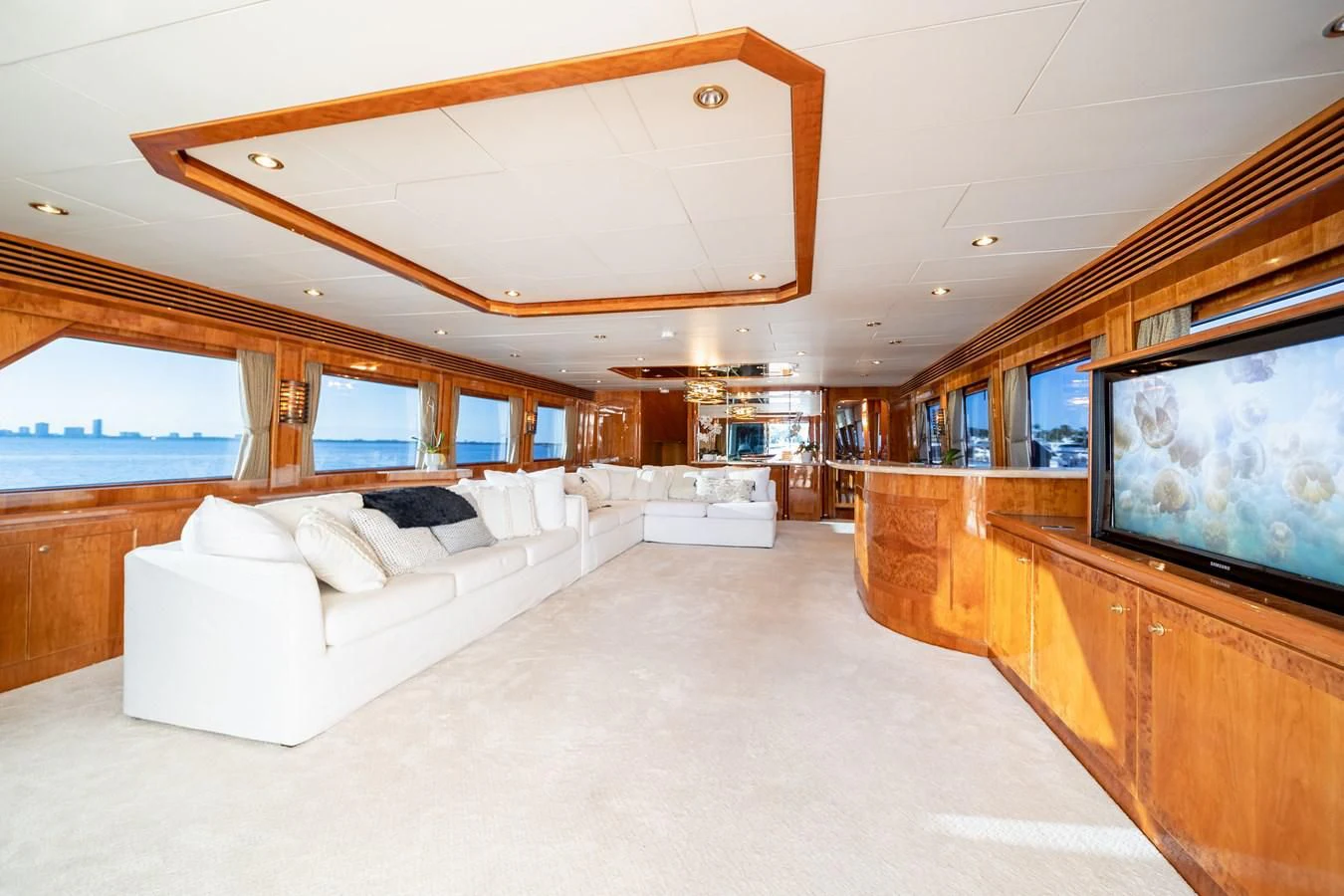 a room with a large bed and a tv aboard HAPPY Yacht for Sale