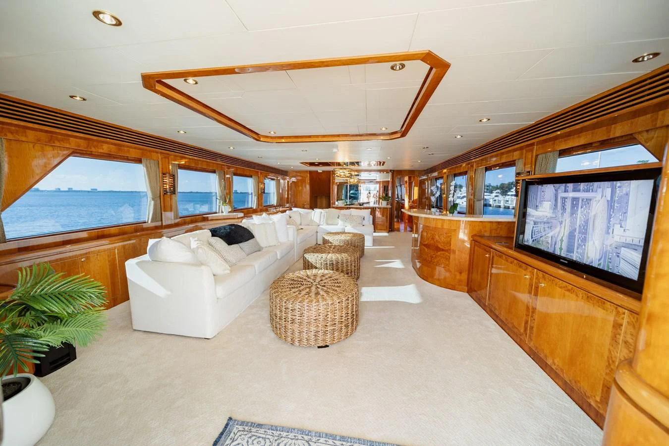 a living room with a large screen aboard HAPPY Yacht for Sale