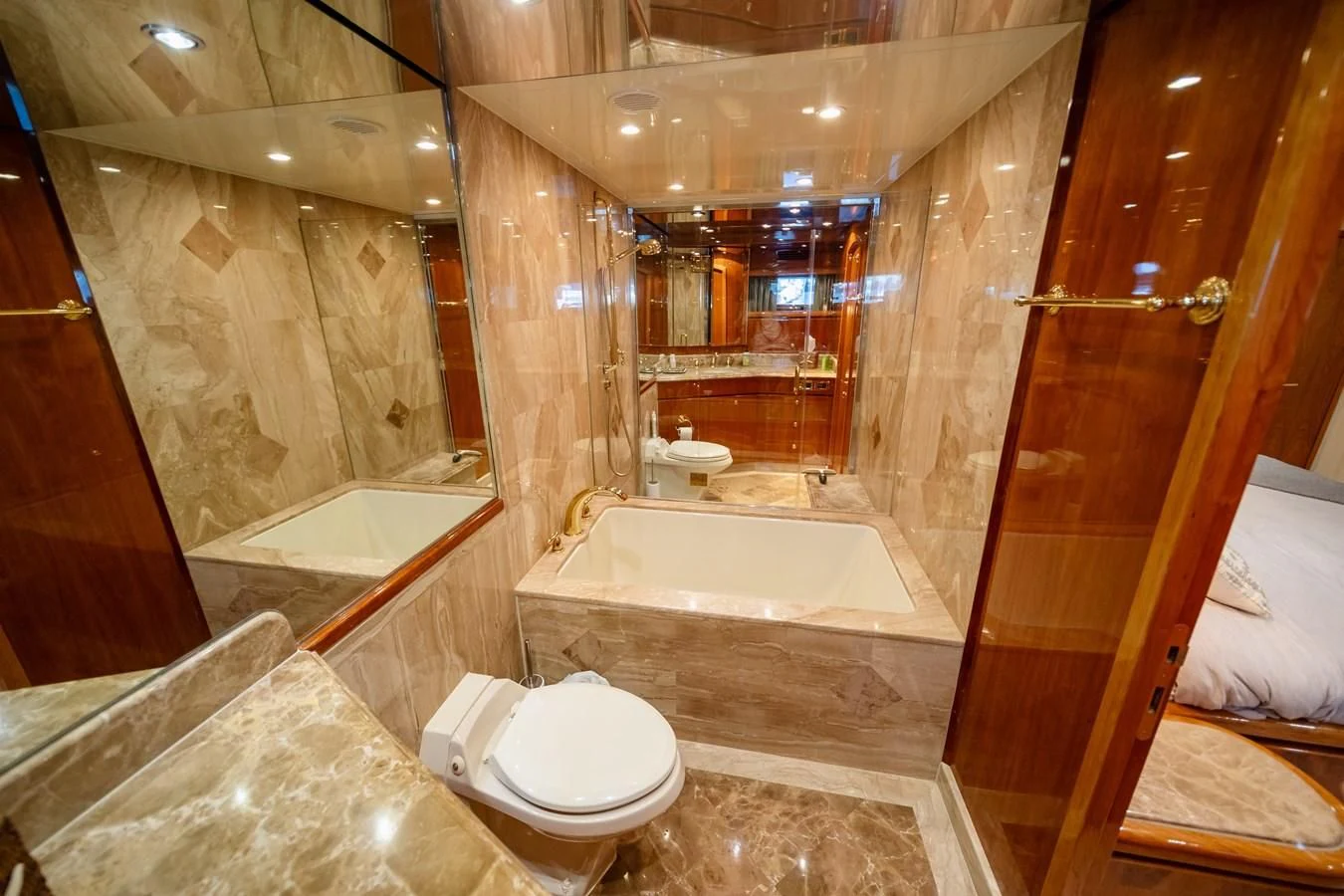 a bathroom with a glass shower aboard HAPPY Yacht for Sale