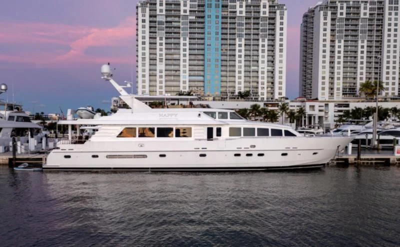 a white yacht in the water aboard HAPPY Yacht for Sale