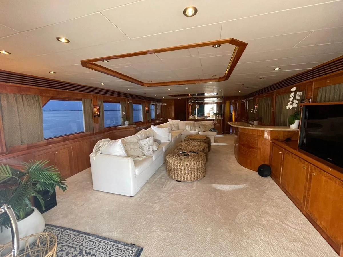 a living room with a large window aboard HAPPY Yacht for Sale