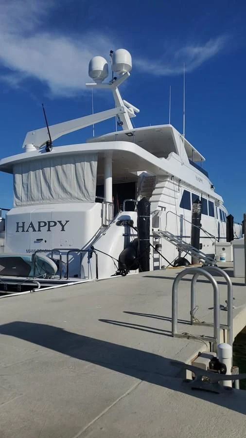 a large white boat aboard HAPPY Yacht for Sale