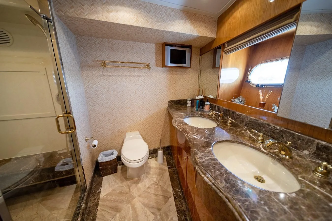 a bathroom with a marble countertop aboard HAPPY Yacht for Sale
