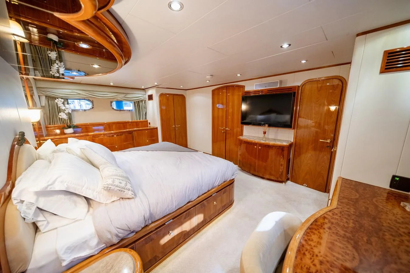 a room with a bed and a television aboard HAPPY Yacht for Sale