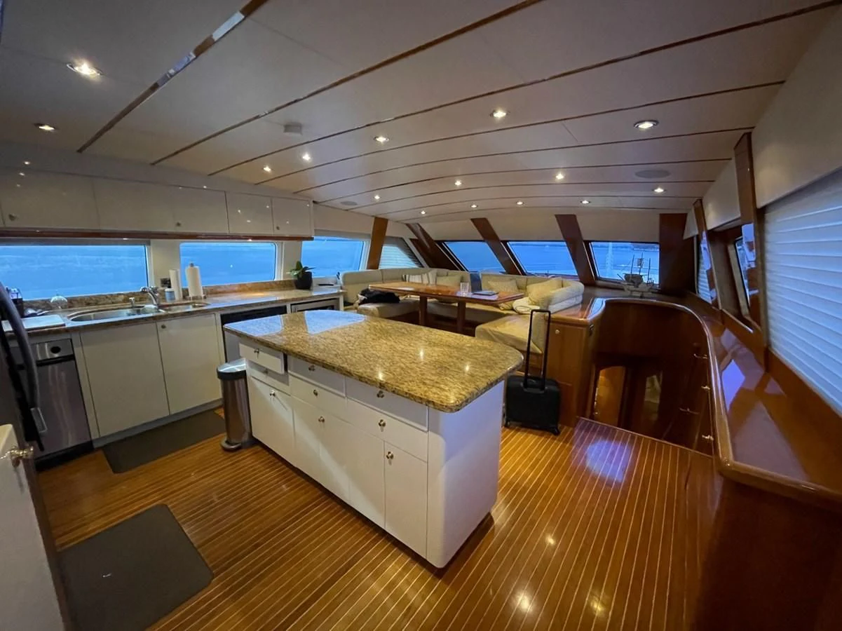 a large kitchen with a large island aboard HAPPY Yacht for Sale