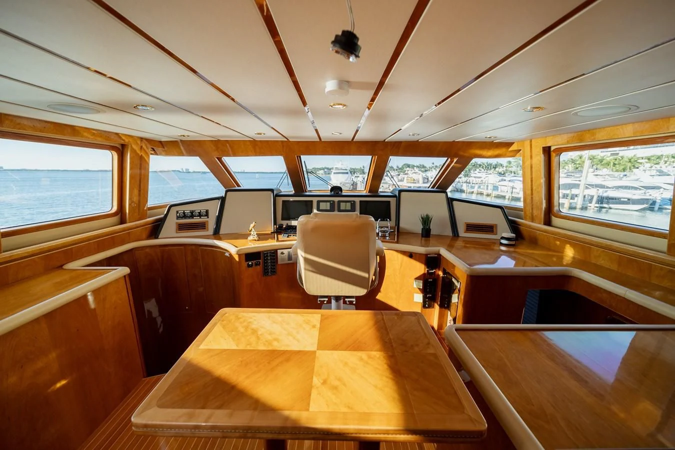 inside of a building with a table and chairs aboard HAPPY Yacht for Sale