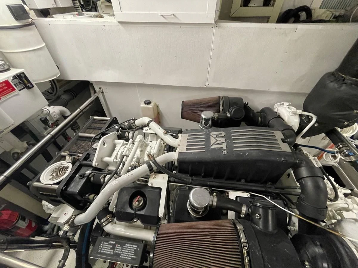 a car engine with a hood aboard HAPPY Yacht for Sale
