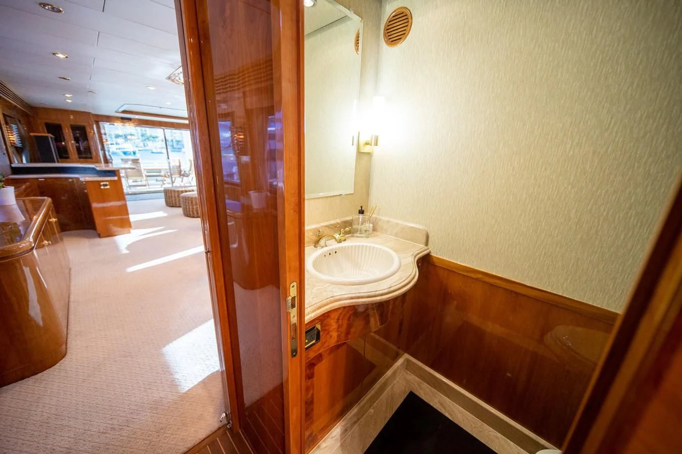 a bathroom with a sink and a mirror aboard HAPPY Yacht for Sale