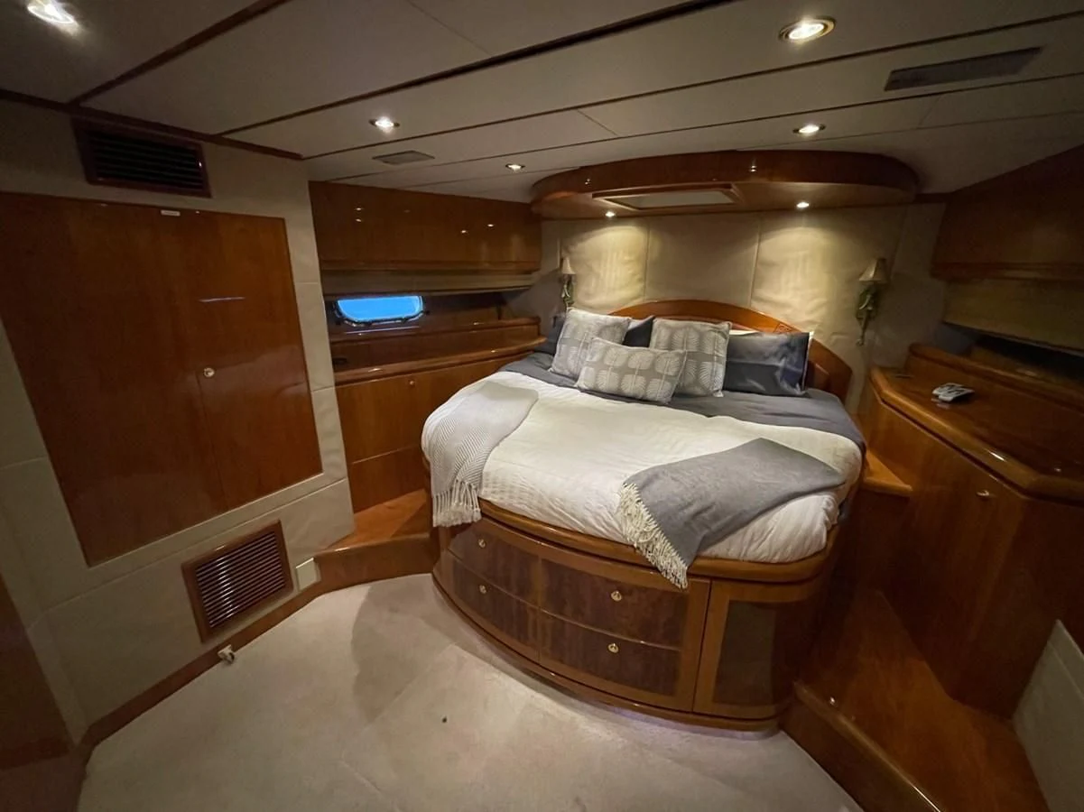 a bed in a room aboard HAPPY Yacht for Sale