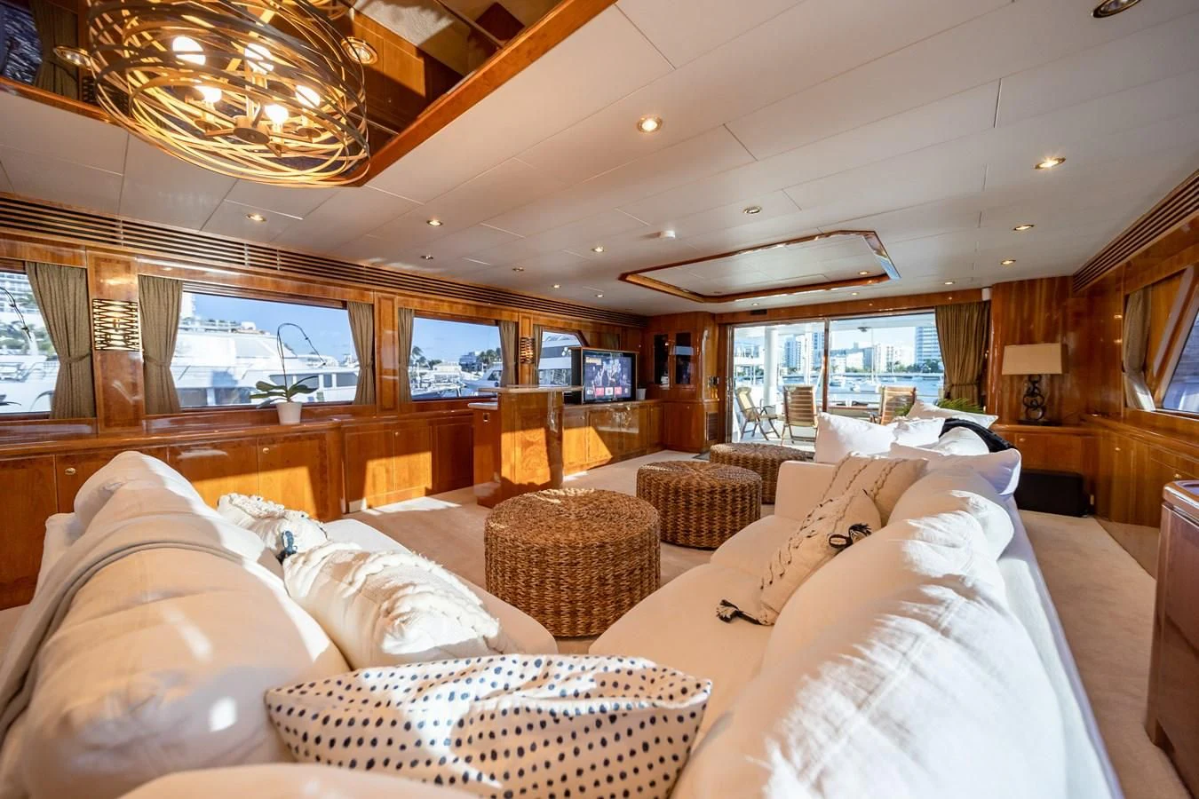 a room with a bed and a chandelier aboard HAPPY Yacht for Sale
