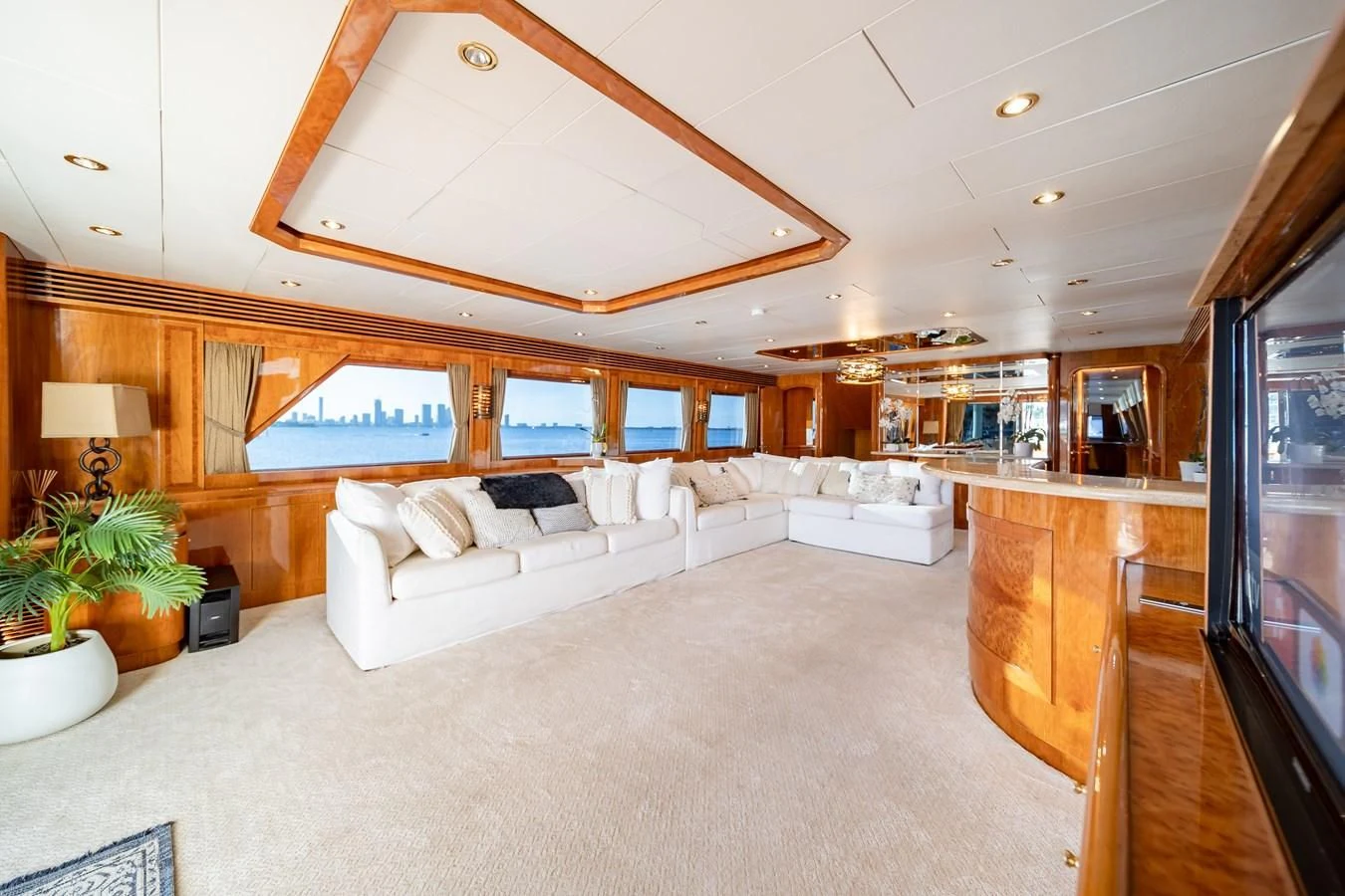a large living room with a large open ceiling aboard HAPPY Yacht for Sale