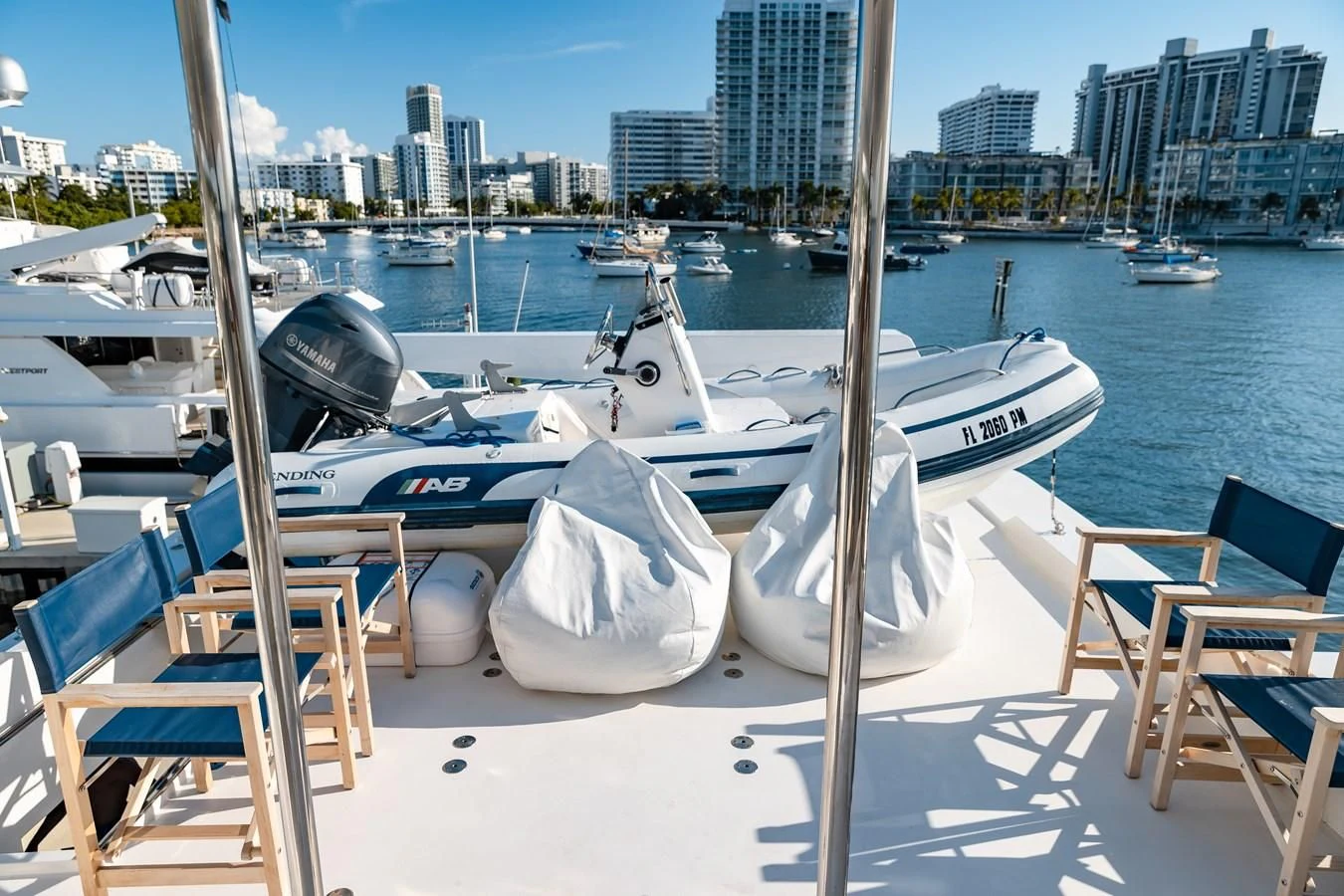 a group of boats are parked on a dock aboard HAPPY Yacht for Sale