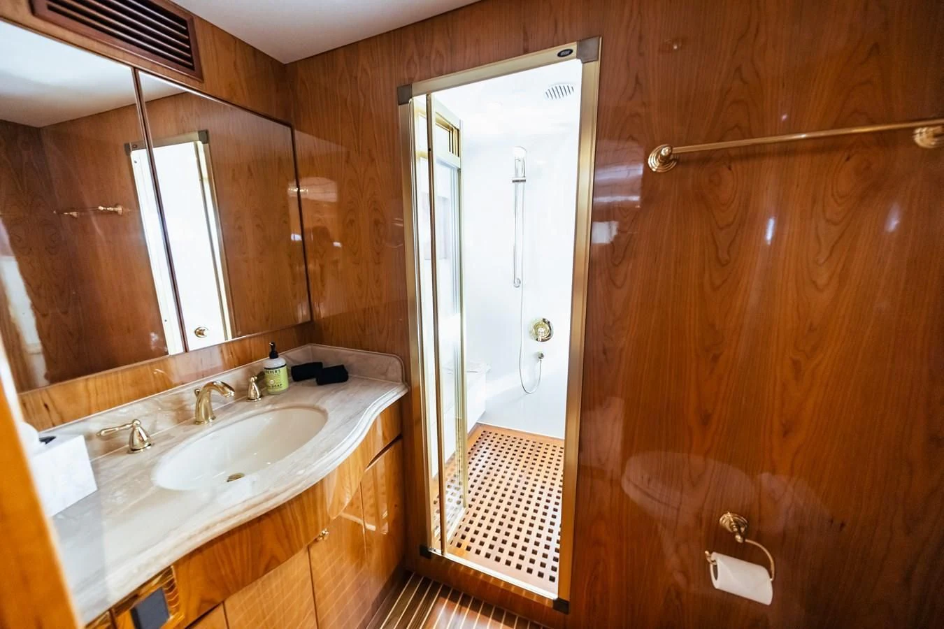 a bathroom with a sink and a mirror aboard HAPPY Yacht for Sale