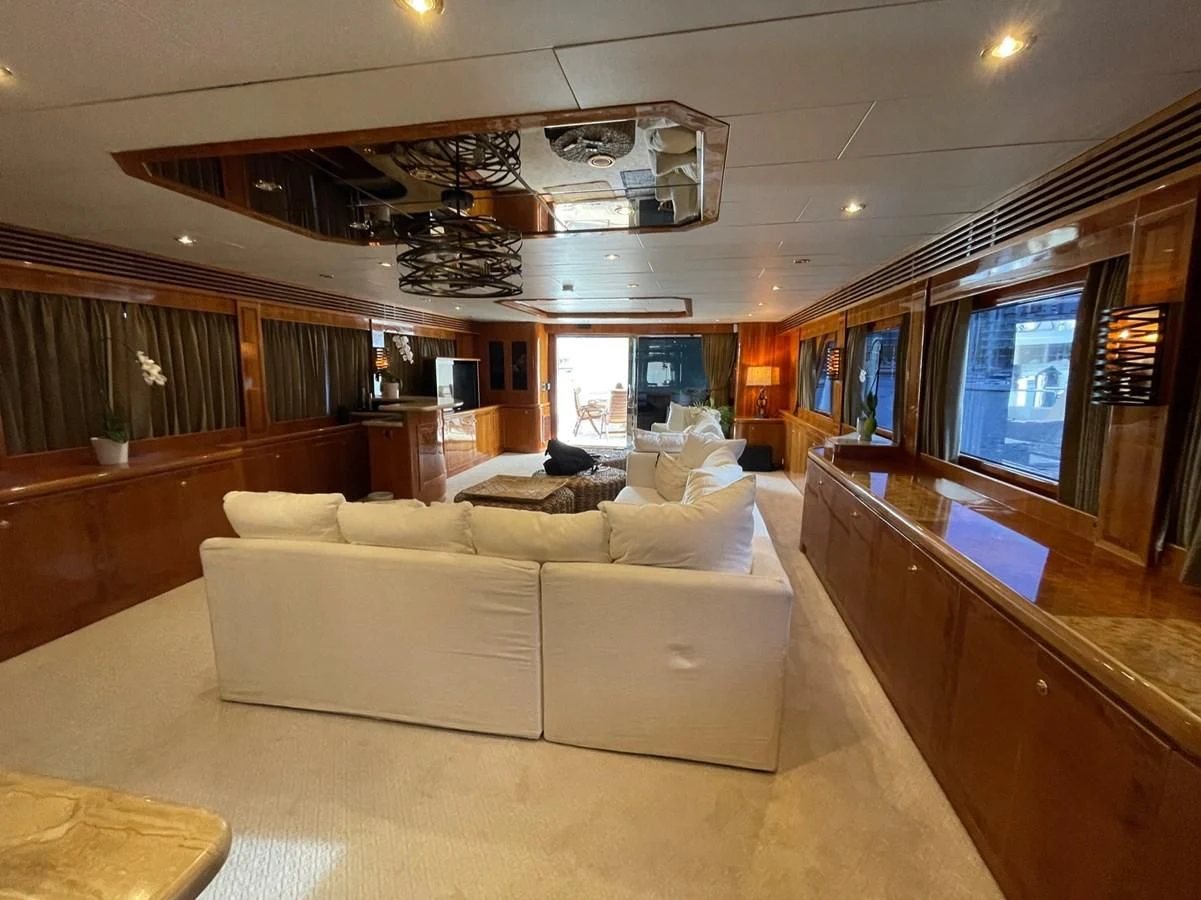 a living room with a couch aboard HAPPY Yacht for Sale