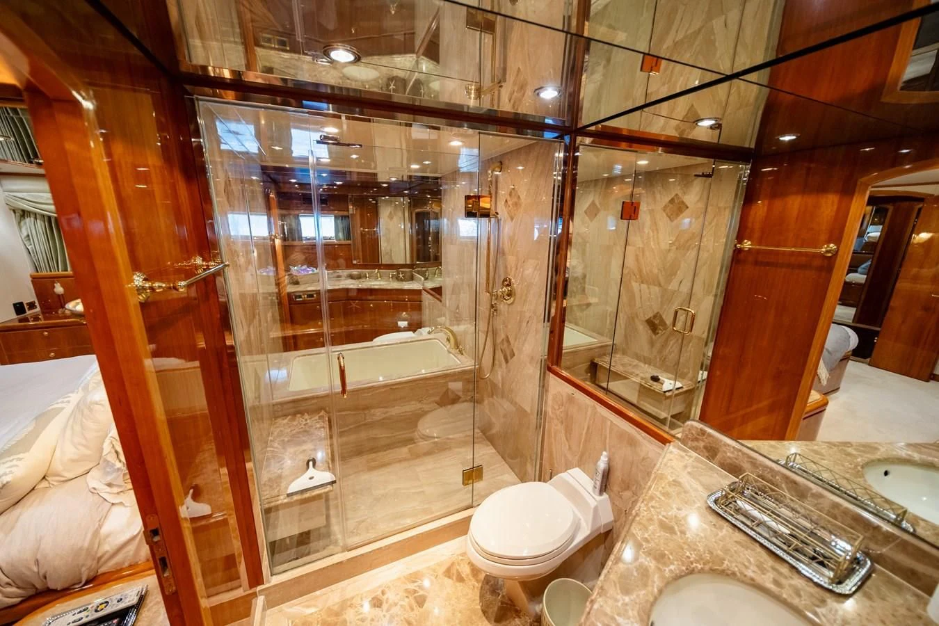 a bathroom with a glass shower aboard HAPPY Yacht for Sale