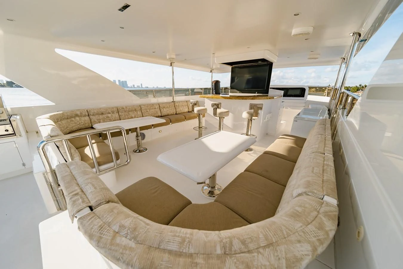 a room with a couch and a television aboard HAPPY Yacht for Sale