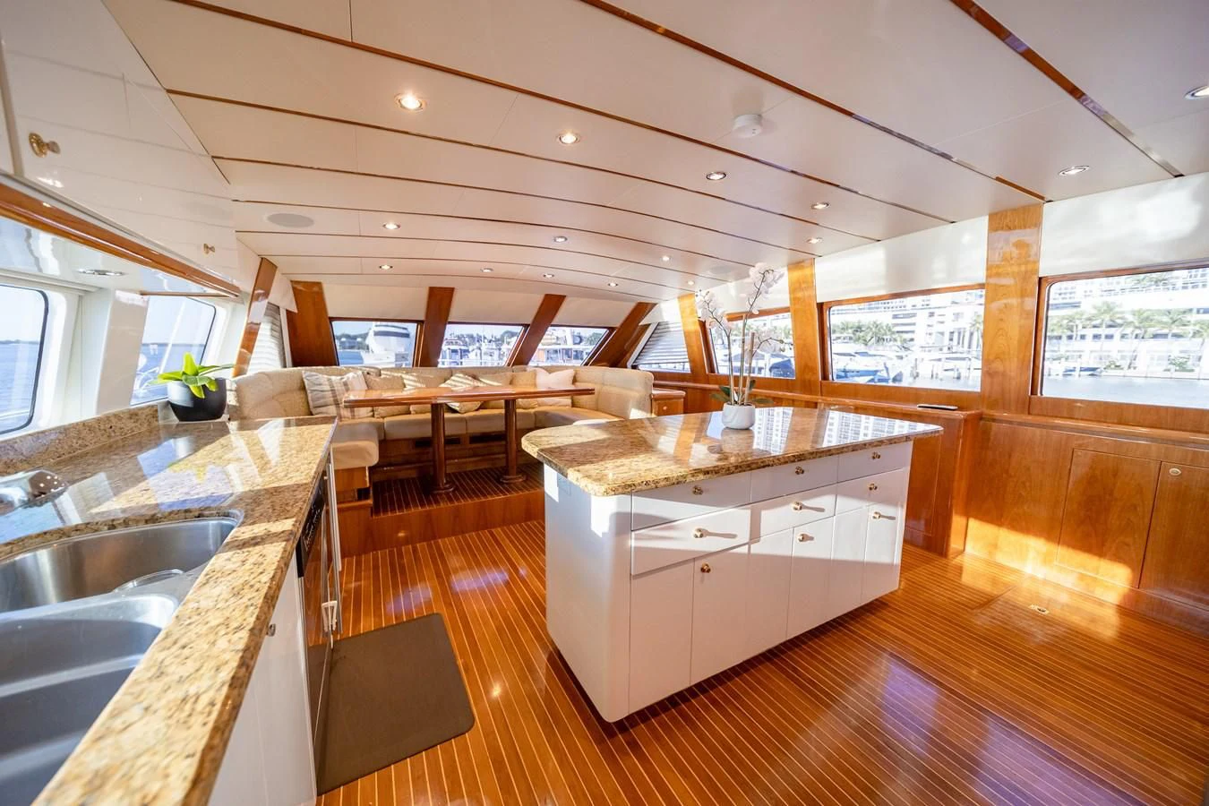 a kitchen with a large island aboard HAPPY Yacht for Sale