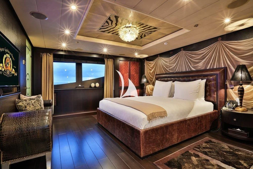 a large bedroom with a large bed aboard DENIKI Yacht for Sale