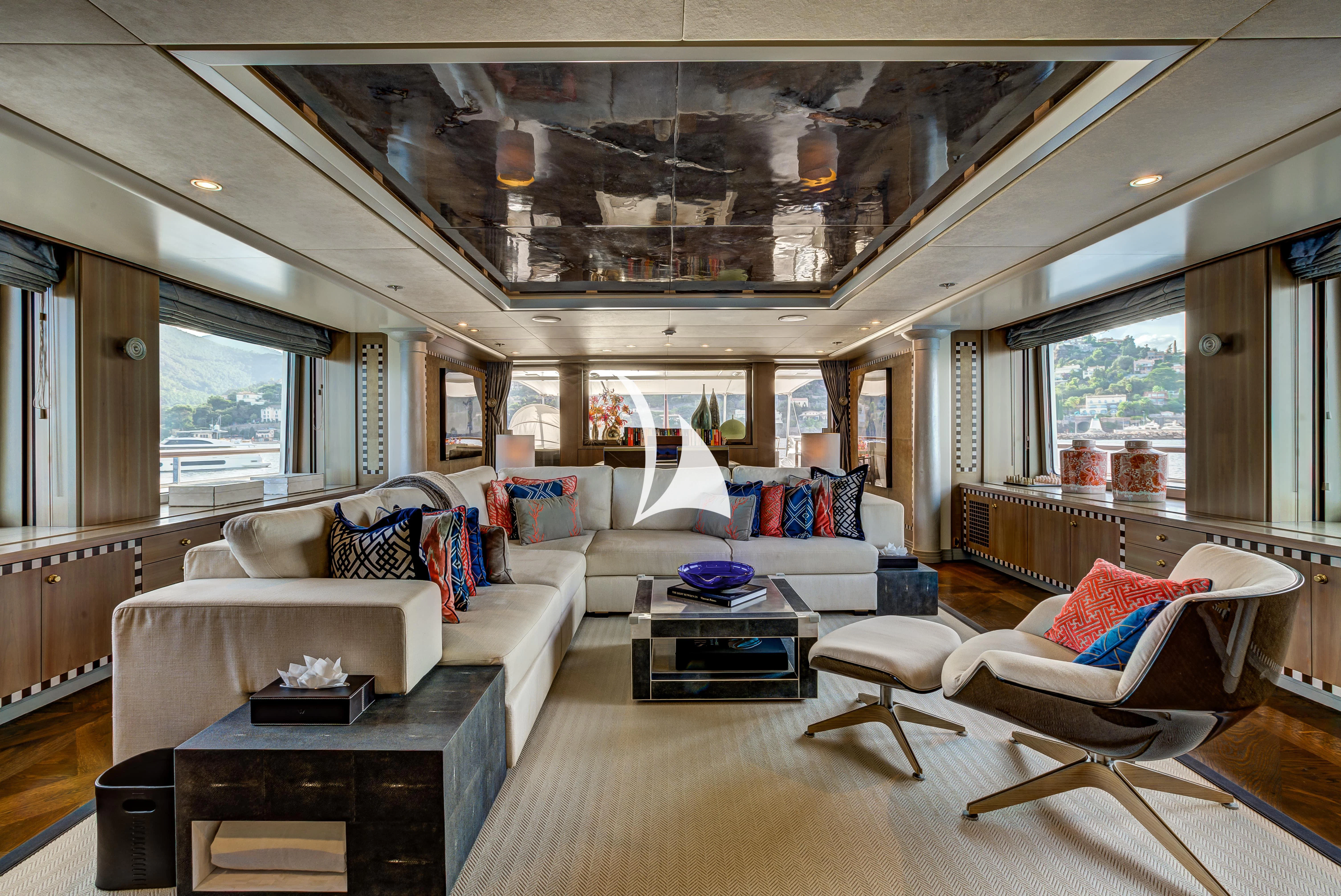 a living room with a large window aboard DENIKI Yacht for Sale
