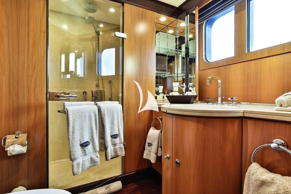 a bathroom with a sink and a mirror aboard DENIKI Yacht for Sale