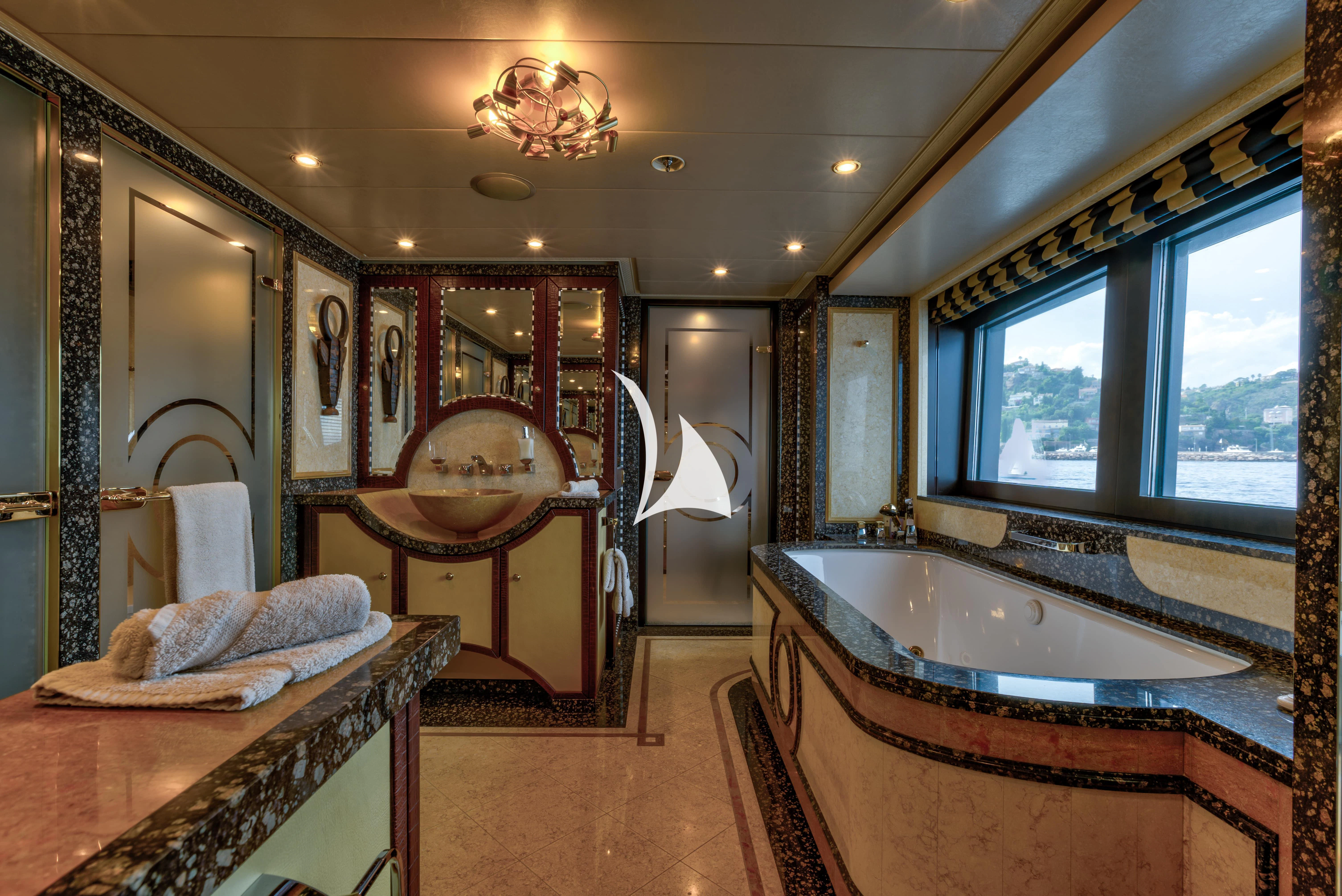 a bathroom with a bathtub and a sink aboard DENIKI Yacht for Sale