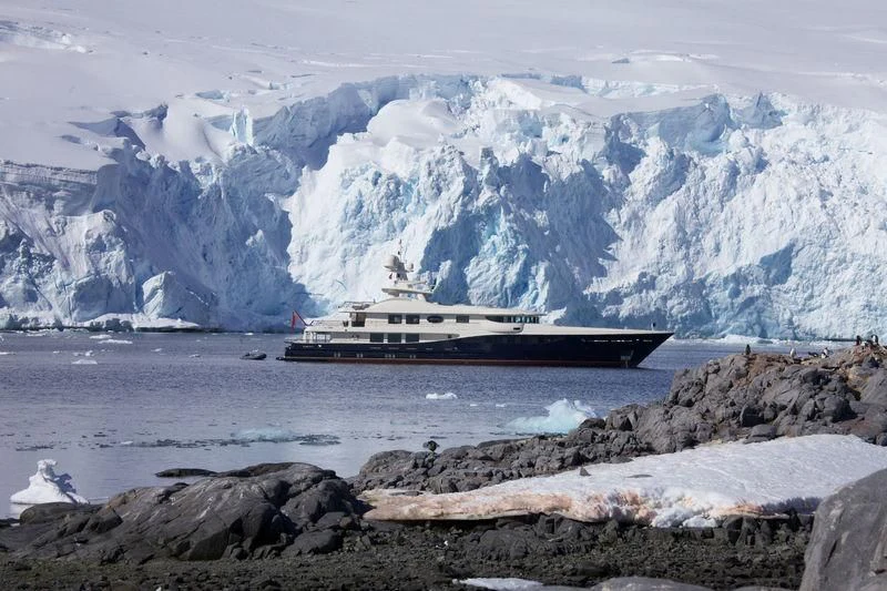 a ship on a rocky shore aboard DENIKI Yacht for Sale