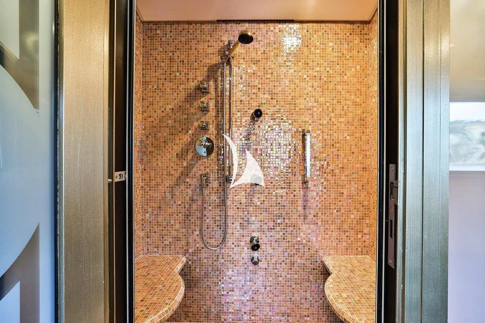 a shower with a glass door aboard DENIKI Yacht for Sale