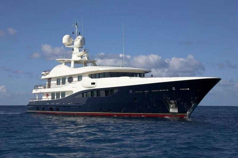 a large boat in the water aboard DENIKI Yacht for Sale