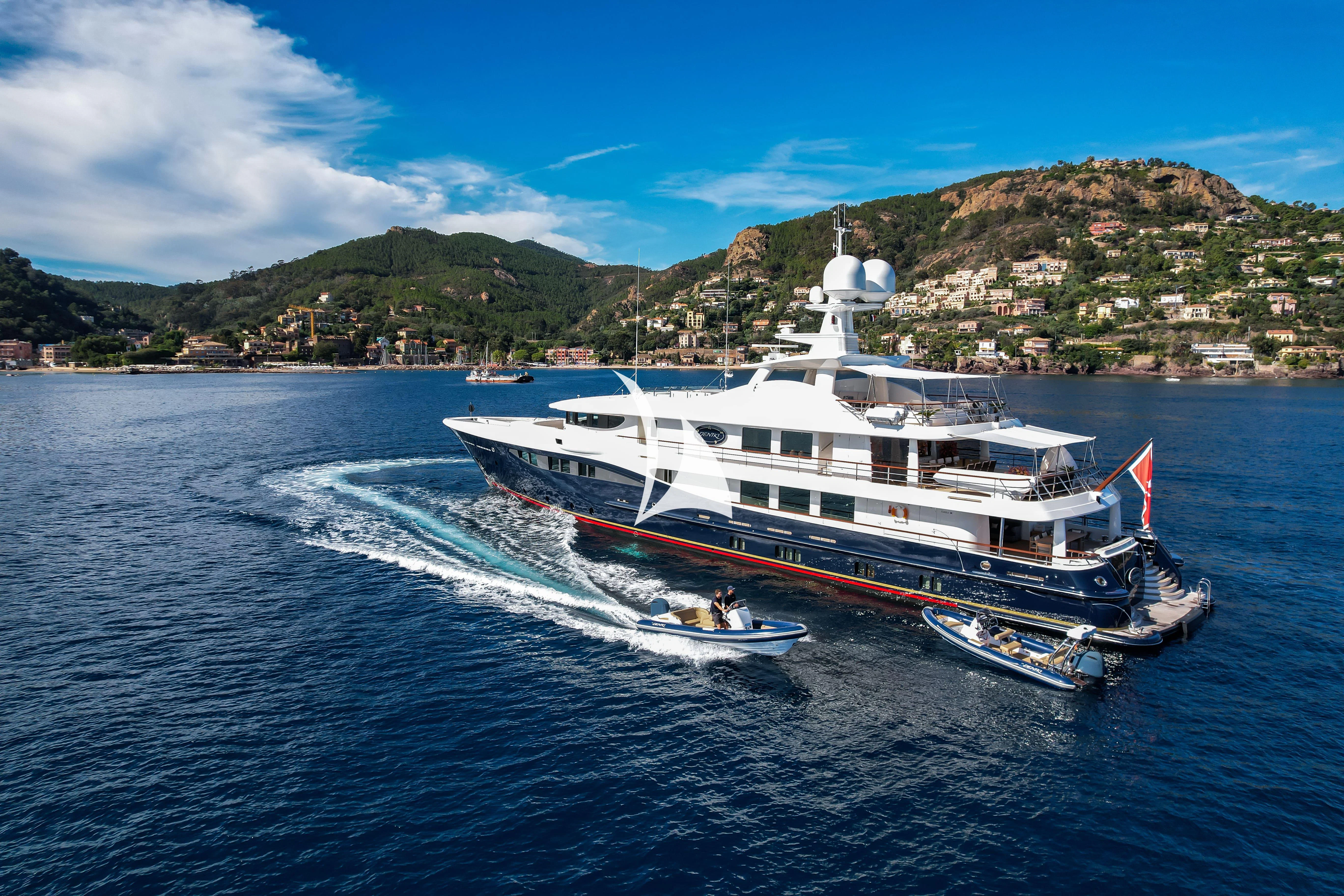 a large boat on the water aboard DENIKI Yacht for Sale