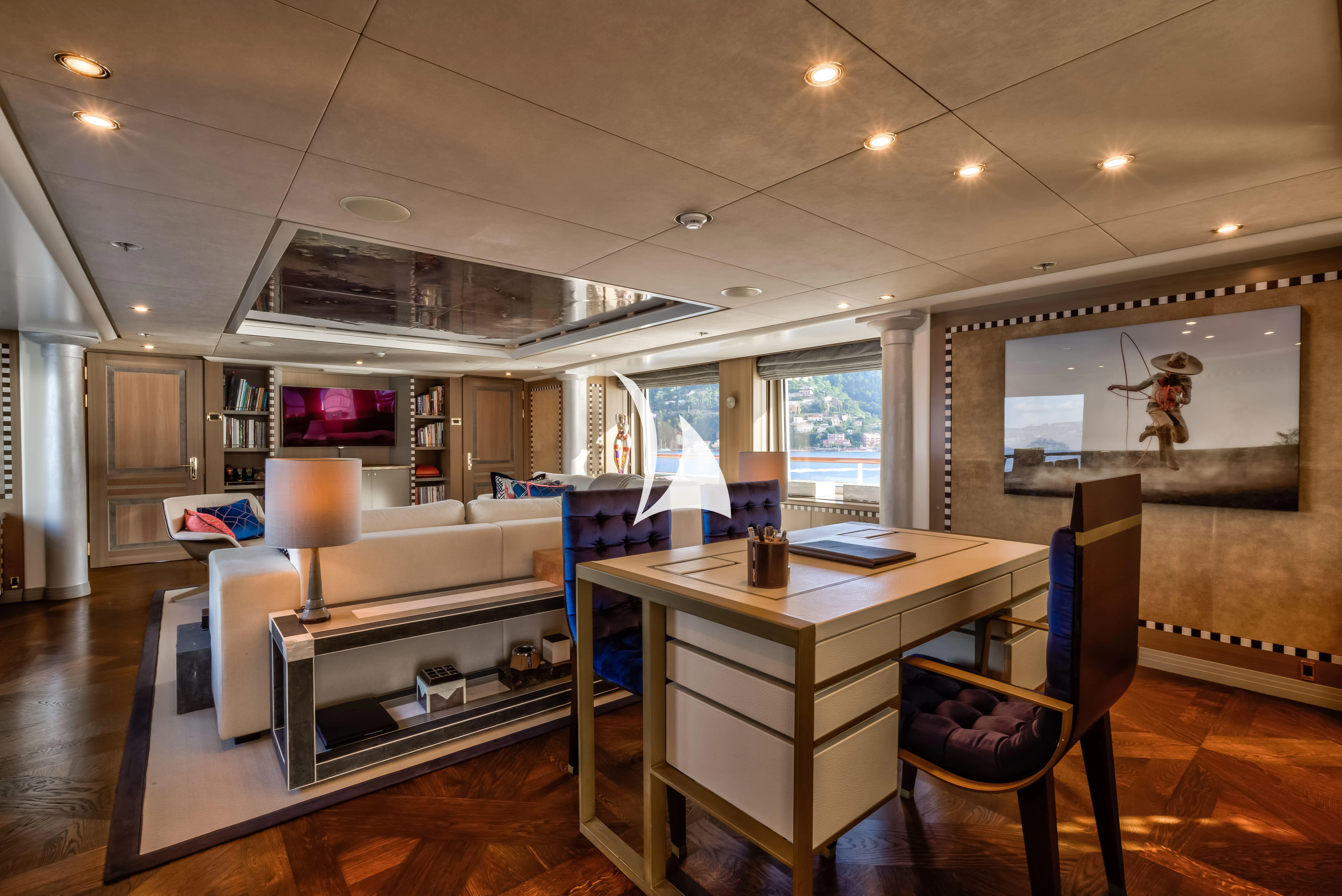 a room with a desk and a bed aboard DENIKI Yacht for Sale