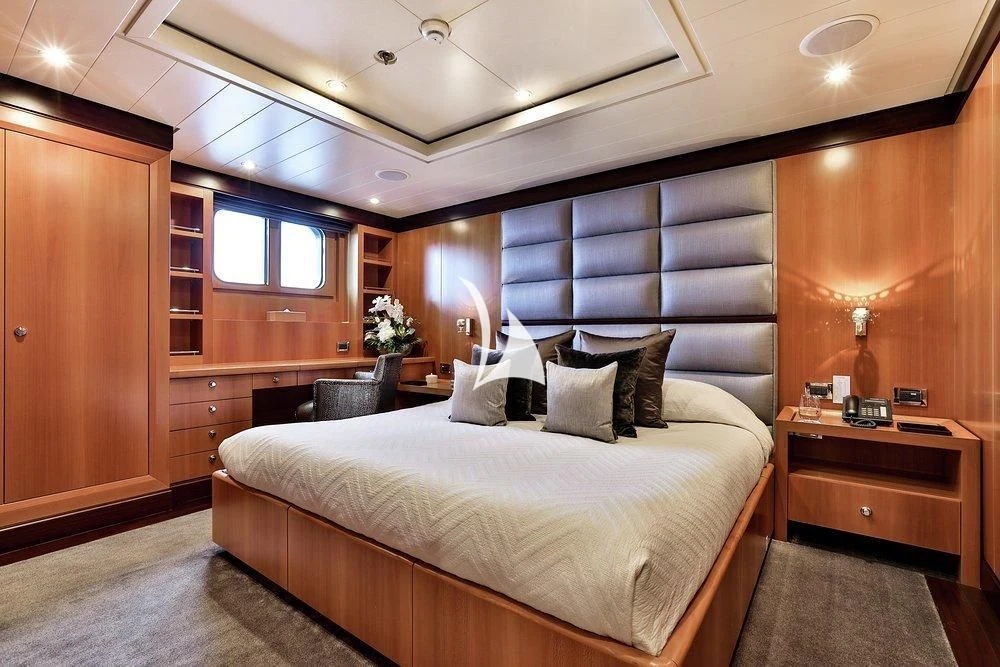 a bed in a room aboard DENIKI Yacht for Sale
