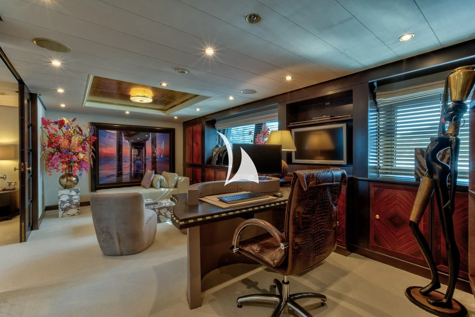 a room with a desk and chairs aboard DENIKI Yacht for Sale