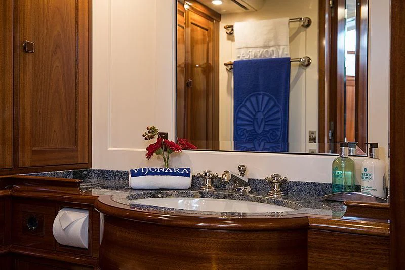 a bathroom with a sink and a mirror aboard VIJONARA Yacht for Sale