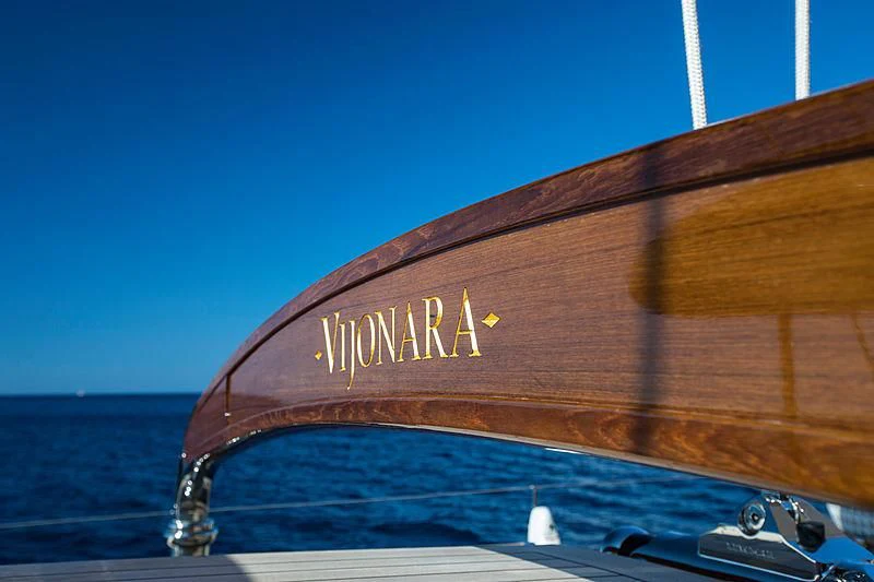 a wooden boat on a beach aboard VIJONARA Yacht for Sale
