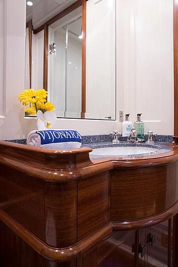 a bathroom with a sink and a mirror aboard VIJONARA Yacht for Sale
