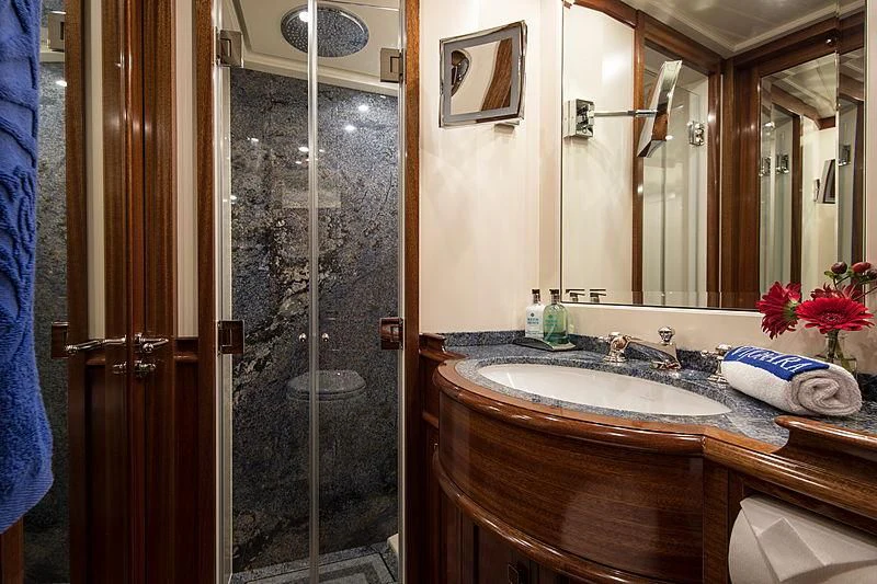 a bathroom with a glass shower aboard VIJONARA Yacht for Sale