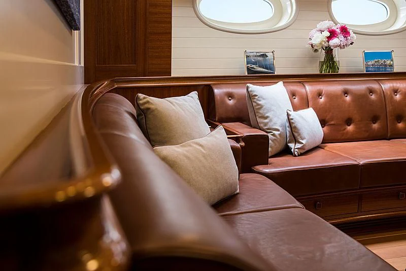 a couch with pillows aboard VIJONARA Yacht for Sale