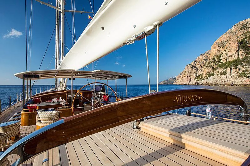 a boat docked at a pier aboard VIJONARA Yacht for Sale
