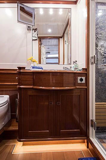 a wooden cabinet with drawers aboard VIJONARA Yacht for Sale