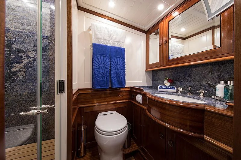 a bathroom with a toilet and a sink aboard VIJONARA Yacht for Sale