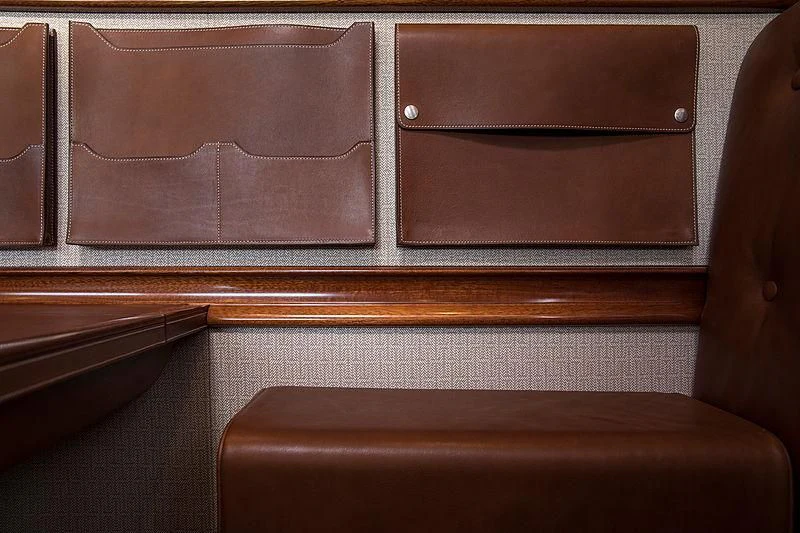 a brown leather chair aboard VIJONARA Yacht for Sale