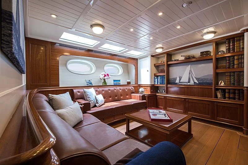 a living room with a couch and a coffee table aboard VIJONARA Yacht for Sale